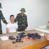 Đối tượng Trần Văn Tuấn bị bắt giữ. (Nguồn: TTXVN)