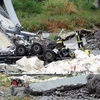Lực lượng cứu hộ làm nhiệm vụ tại hiện trường vụ sập cầu cạn ở Genoa, Italy ngày 14/8. (Ảnh: EPA/TTXVN)