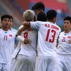 Các cầu thủ Olympic Việt Nam mừng bàn thắng vào lưới Olympic Nhật Bản trong trận đấu ở bảng D, ASIAD 2018 ở Cikarang, Indonesia ngày 19/8. (Ảnh: AFP/TTXVN)