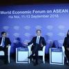 Chủ tịch Diễn đàn Kinh tế Thế giới Borge Brende (giữa) bày tỏ sự hài lòng về kết quả Hội nghị WEF ASEAN 2018 diễn ra tại Hà Nội, từ 11-13/9/2018. (Ảnh: Lâm Khánh/TTXVN)