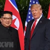 Tổng thống Mỹ Donald Trump (phải) và nhà lãnh đạo Triều Tiên Kim Jong-un. (Ảnh: AFP/TTXVN)