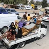 Người dân Syria rời bỏ nhà cửa đi lánh nạn do lo ngại xung đột leo thang tại tỉnh Idlib ngày 9/9. (Ảnh: AFP/TTXVN)