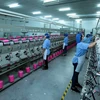 Dây chuyền sản xuất sợi tại Công ty trách nhiệm hữu hạn Dệt nhuộm Jasan Việt Nam vốn đầu tư của Trung Quốc tại khu công nghiệp Phố nối B, huyện Mỹ Hào, tỉnh Hưng Yên. (Ảnh: Phạm Kiên/TTXVN)