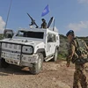 Lực lượng gìn giữ hòa bình Liên hợp quốc tại miền nam Liban (UNIFIL) tuần tra ở thị trấn Naqura, giáp với Israel. (Ảnh: AFP/TTXVN)