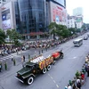Đoàn xe tang Chủ tịch nước Trần Đại Quang di chuyển trên đường phố Hà Nội, sáng 27/9. (Ảnh: Danh Lam/TTXVN)