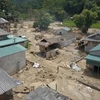 Bản Qua, xã Quang Chiểu, huyện Mường Lát, tỉnh Thanh Hóa tan hoang với gần 30 ngôi nhà bị sập và hư hỏng nặng vì bùn đất trong đợt lũ quét hồi tháng Tám. (Ảnh: Đạt Quyết/TTXVN)