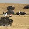 Các lực lượng an ninh Iraq trong một chiến dịch truy quét phiến quân IS. (Nguồn: AFP/TTXVN)