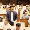 Tổng Thanh tra Chính phủ Lê Minh Khái trả lời chất vấn của Đại biểu Quốc hội. (Ảnh: Phương Hoa/TTXVN)