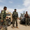 Các tay súng Lực lượng Dân chủ Syria được Mỹ hậu thuẫn tham gia chiến dịch chống IS tại tỉnh Deir Ezzor,miền đông Syria. (Ảnh: AFP/TTXVN)