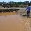 Suối Đại Lào bị ảnh hưởng, bồi lắng do hoạt động khai thác cát. (Ảnh: Nguyễn Dũng/TTXVN)