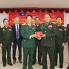 Quang cảnh Lễ bàn giao bộ phim về lịch sử Quân đội nhân dân Lào. (Ảnh: Xuân Tú/TTXVN)