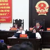 Thẩm phán Nguyễn Vinh Quang chủ tọa phiên tòa. (Ảnh: Trung Kiên/TTXVN)