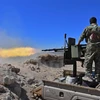 Lực lượng SDF trong chiến dịch tấn công tại làng Baghouz, nơi cố thủ cuối cùng của IS tại miền Đông Syria, ngày 18/3/2019. (Ảnh: AFP/TTXVN)