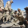 Lực lượng ủng hộ Chính phủ Libya giao tranh với các tay súng từ miền Đông tại Tripoli ngày 8/4/2019. (Ảnh: AFP/TTXVN)