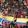 Những người ủng hộ Tổng thống Nicolas Maduro tham gia cuộc tuần hành tại thủ đô Caracas, Venezuela, ngày 13/4. (Ảnh: AFP/TTXVN)