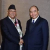Thủ tướng Chính phủ Nguyễn Xuân Phúc gặp Thủ tướng Nepal K P Sharma Oli bên lề Hội nghị thường niên Diễn đàn Kinh tế Thế giới WEF Davos tháng 1/2019. (Ảnh: Thống Nhất/TTXVN)