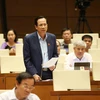 Bộ trưởng Bộ Lao động Thương binh và Xã hội Đào Ngọc Dung trả lời chất vấn của đại biểu Quốc hội. (Ảnh: Phương Hoa/TTXVN)