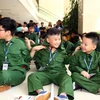 Các 'phóng viên chiến trường nhí' tại lễ khai giảng Học kỳ quân đội 2019. (Ảnh: Danh Lam/TTXVN)