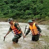 Đồn Biên phòng Ra Mai, Ban Chỉ huy Quân sự huyện Minh Hóa, chính quyền xã Trọng Hóa và nhân dân bản Pa Choong đã được huy động, túc trực và tổ chức tìm kiếm nạn nhân mất tích. (Ảnh: Võ Dung/TTXVN)