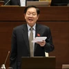 Bộ trưởng Nội vụ Lê Vĩnh Tân phát biểu làm rõ một số vấn đề đại biểu Quốc hội nêu. (Ảnh: Văn Điệp/TTXVN)