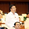 Bộ trưởng Bộ Tư pháp Lê Thành Long phát biểu, giải trình, làm rõ một số nội dung đại biểu Quốc hội nêu. (Ảnh: Trọng Đức/TTXVN)