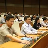 Các đại biểu Quốc hội biểu quyết thông qua Nghị quyết về dự toán ngân sách nhà nước 2020. (Ảnh: Dương Giang/TTXVN)