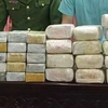 Số tang vật 18kg ma túy đá và 30 bánh heroin bị thu giữ tại cơ quan công an. (Ảnh: TTXVN)