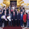 Phó Thủ tướng, Bộ trưởng Bộ Ngoại giao Phạm Bình Minh với các đại biểu. (Ảnh: Lâm Khánh/TTXVN)