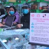 Người dân đổ xô mua khẩu trang để phòng dịch bệnh do virus corona. (Ảnh: Trịnh Duy Hưng/TTXVN)