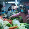 Người dân mua hàng tại chợ ở Vũ Hán, Trung Quốc. (Nguồn: Filipinotimes)