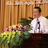 Chủ tịch Hội đồng Nhân dân tỉnh Bắc Ninh Nguyễn Quốc Chung phát biểu tại kỳ họp. (Ảnh: Thanh Thương/TTXVN)