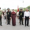 Thủ tướng Nguyễn Xuân Phúc, Chủ tịch Quốc hội Nguyễn Thị Kim Ngân và các đại biểu Quốc hội dự buổi ra mắt và diễu binh của lực lượng Cảnh sát cơ động kỵ binh. (Ảnh: Trọng Đức/TTXVN)