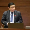 Bộ trưởng Bộ Kế hoạch và Đầu tư Nguyễn Chí Dũng phát biểu giải trình, làm rõ vấn đề đại biểu Quốc hội nêu. (Ảnh: Văn Điệp/TTXVN)