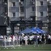 Người dân xếp hàng chờ xét nghiệm COVID-19 tại Bắc Kinh, Trung Quốc, ngày 16/6/2020. (Ảnh: AFP/TTXVN)