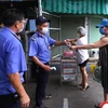Đa số người dân Đà Nẵng nghiêm túc phối hợp với chính quyền thực hiện các biện pháp phòng, chống dịch. (Ảnh: Quốc Dũng/TTXVN)