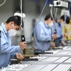 Công nhân sản xuất tại một phân xưởng ở Quảng Châu, thủ phủ tỉnh Quảng Đông, Trung Quốc. (Nguồn: THX/TTXVN)