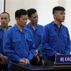 Các bị cáo Đào Xuân Hùng, Hoàng Ánh Dương, Hoàng Huy Bình và Hoàng Xuân Hòa tại phiên tòa nghe Hội đồng xét xử tuyên án. (Ảnh: Vũ Hà/TTXVN)