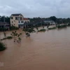 Nước sông Hiếu dâng cao, gây ngập lụt nhà dân và đường giao thông ở phường Đông Thanh, thành phố Đông Hà, tỉnh Quảng Trị trong đợt mưa lũ vừa qua. (Ảnh: Hồ Cầu/TTXVN)