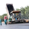 Thảm nhựa tuyến đường ưu tiên trong Khu tái định cư Lộc An-Bình Sơn. (Ảnh: Công Phong/TTXVN)