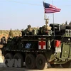 Xe quân sự Mỹ di chuyển gần làng Yalani ở ngoại ô phía Tây thành phố Manbij, Syria. (Ảnh minh họa: AFP/TTXVN)