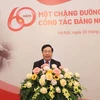 Ông Phạm Bình Minh, Ủy viên Bộ Chính trị, Phó Thủ tướng, Bí thư Ban Cán sự Đảng, Bộ trưởng Bộ Ngoại giao phát biểu tại buổi gặp mặt kỷ niệm 60 năm công tác Đảng ngoài nước. (Ảnh: Lâm Khánh/TTXVN)