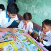 Chương trình 'Tủ sách Đinh Hữu Dư' đã mang hàng ngàn cuốn sách đến cho trẻ em vùng khó khăn ở nhiều địa phương trên cả nước. (Ảnh: TTXVN)