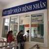 Người dân đăng ký khám chữa bệnh bảo hiểm y tế. (Ảnh: Vietnam+)