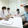 Khu vực khám sàng lọc trước tiêm cho các tình nguyện viên tham gia tiêm thử nghiệm đợt 3 vaccine Nano Covax phòng COVID-19 tại Học viện Quân y. (Ảnh: Minh Quyết/TTXVN)
