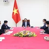 Thủ tướng Phạm Minh Chính điện đàm với Thủ tướng Pháp Jean Castex. (Ảnh: Dương Giang/TTXVN)