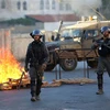  Cảnh sát biên giới Israel trong cuộc xung đột với người biểu tình Palestine tại làng Turmus Ayya, gần Ramallah, Khu Bờ Tây ngày 8/7/2021. (Ảnh: THX/TTXVN)