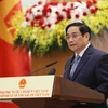 Thủ tướng Phạm Minh Chính đọc diễn văn tại Lễ kỷ niệm. (Ảnh: Dương Giang/TTXVN)