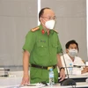 Đại tá Trần Văn Chính, Phó Giám đốc, Thủ trưởng Cơ quan cảnh sát điều tra (Công an tỉnh Bình Dương) cung cấp thông tin tại Hội nghị. (Ảnh: Chí Tưởng/TTXVN)