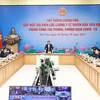 Thủ tướng Phạm Minh Chính đã gặp mặt, tuyên dương các thầy thuốc tiêu biểu, xuất sắc của ngành y tế, quân đội và công an trong công tác phòng, chống dịch COVID-19. (Ảnh: Dương Giang/TTXVN)