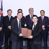 Thủ tướng Chính phủ Phạm Minh Chính chứng kiến Lễ trao biên bản hợp tác giữa các doanh nghiệp Việt Nam và Anh. (Ảnh: Dương Giang/TTXVN)